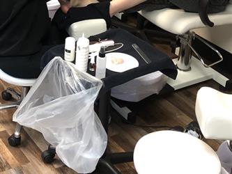 Cosmetology students learning about nail services