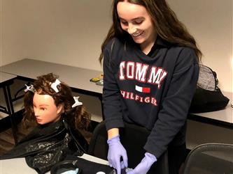 Cosmetology student learning about virgin relaxer services