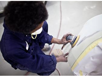 Person buffing a vehicle