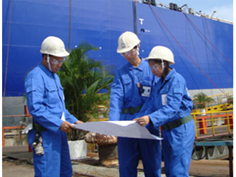 Workers going over schematics