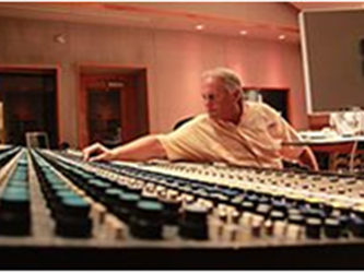 Man working on sound board
