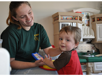 Teacher working with a young child