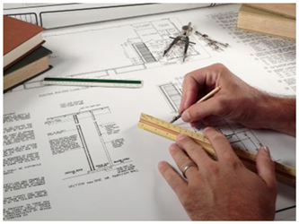 Person hand drawing schematics